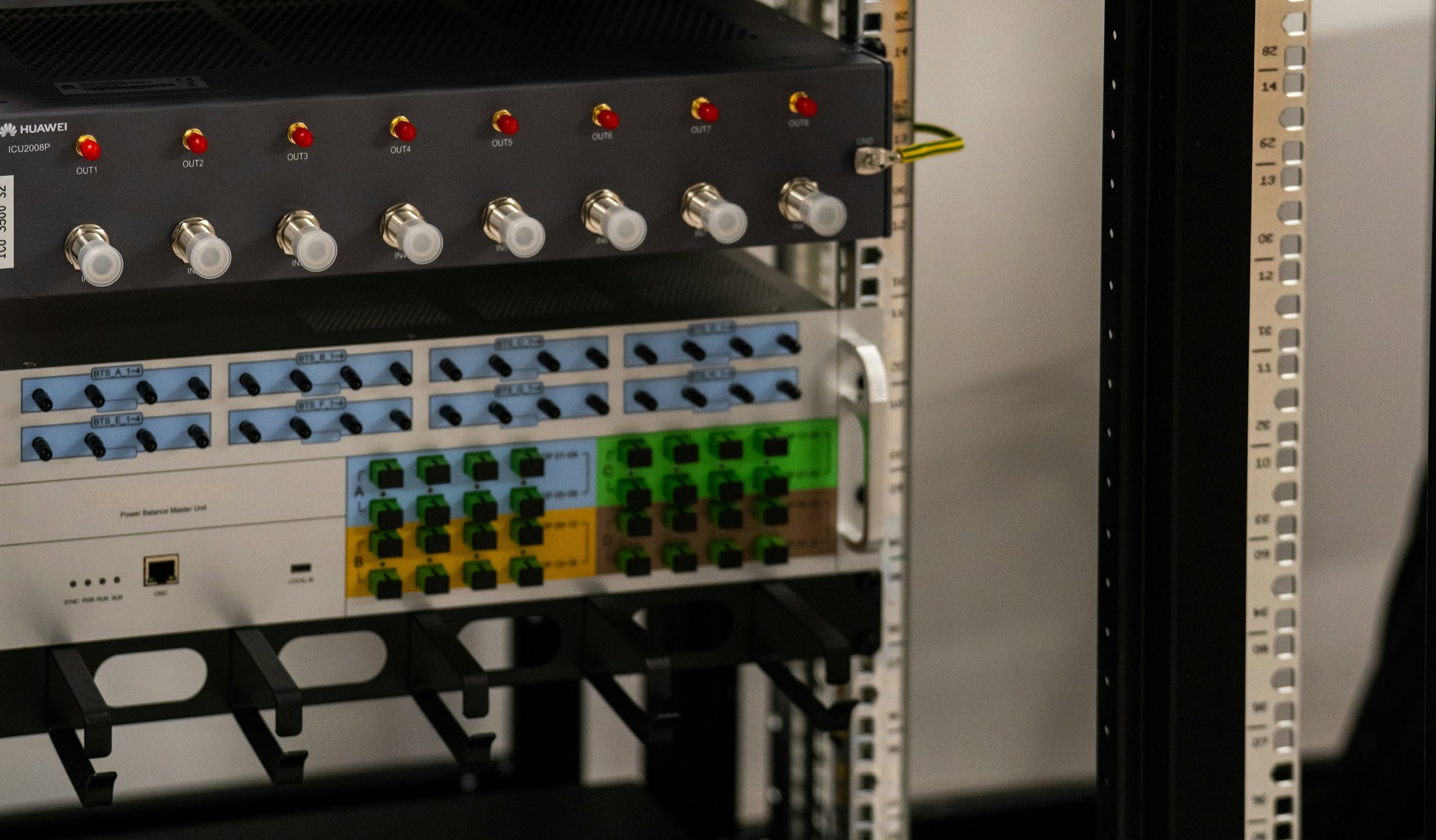 A server rack filled with network and electronic equipment