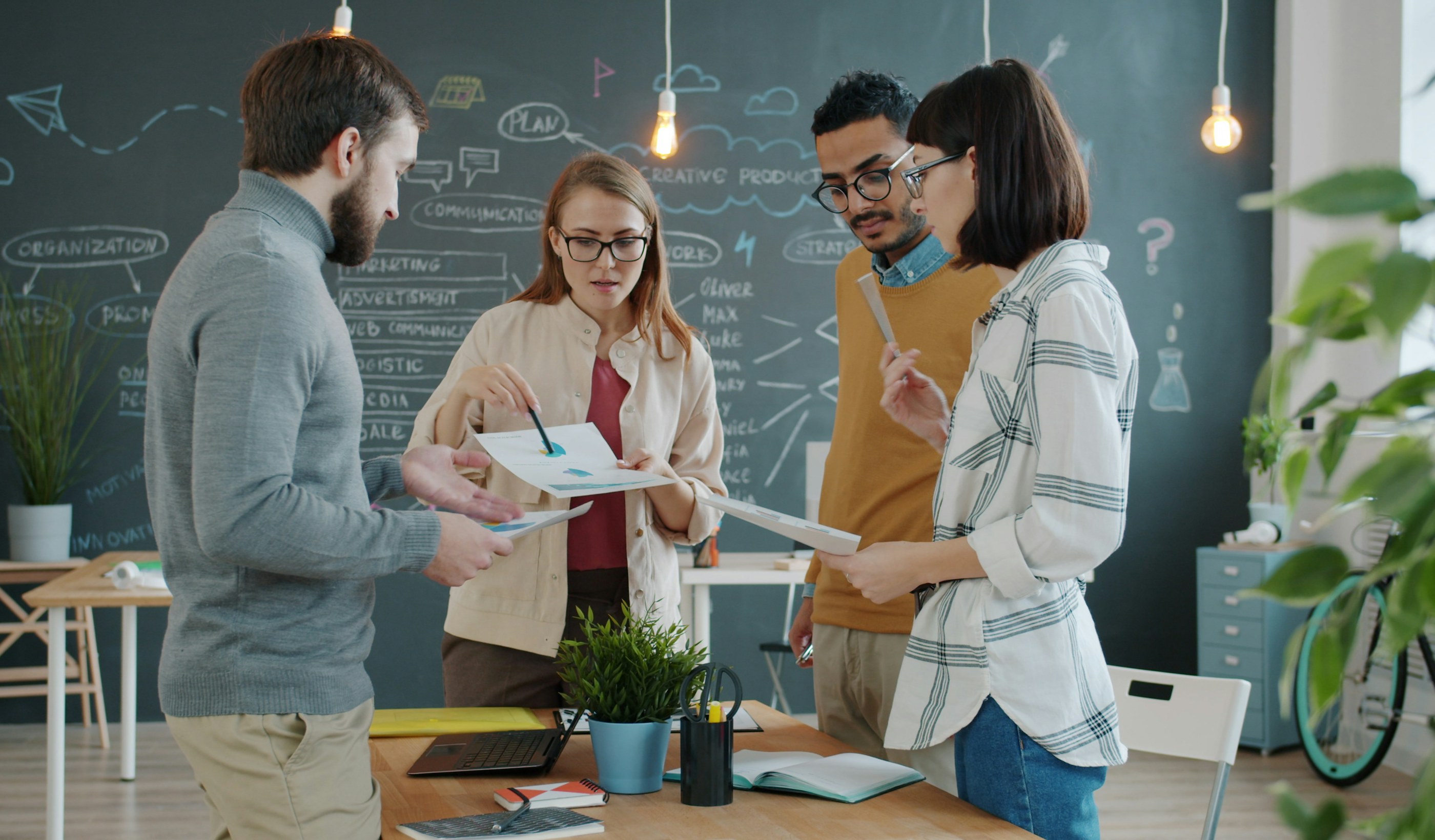 A team collaborating on a project together in an office