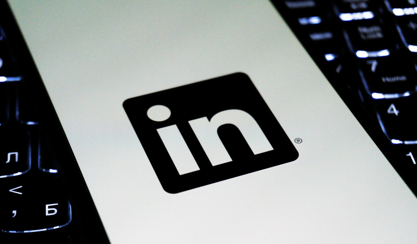 A close-up of the LinkedIn logo on an illuminated laptop keyboard
